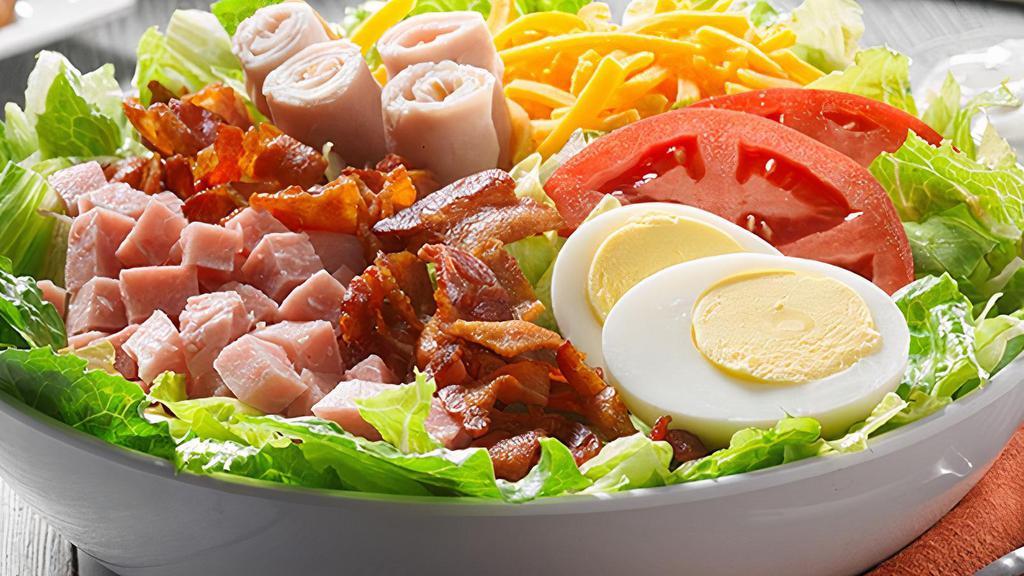 Chef Salad · A generous blend of deli ham, turkey, bacon, Cheddar and mozzarella cheeses, egg, tomato, onion and green pepper.