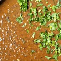 Dal Makhani · Black lentils cooked in butter with Indian spices.