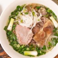 Phở Tái Nạm Gầu · Beef noodle soup with eye round steak, well done flank and fat brisket.