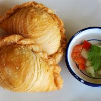 Curry Puffs · Two large Thai-style pastry puffs filled with optional chicken, carrot, potato, and curry, d...