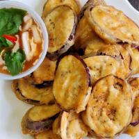 Crispy Eggplant (App) · Sliced eggplant lightly battered and deep fried, served with a spicy basil sauce on the side...