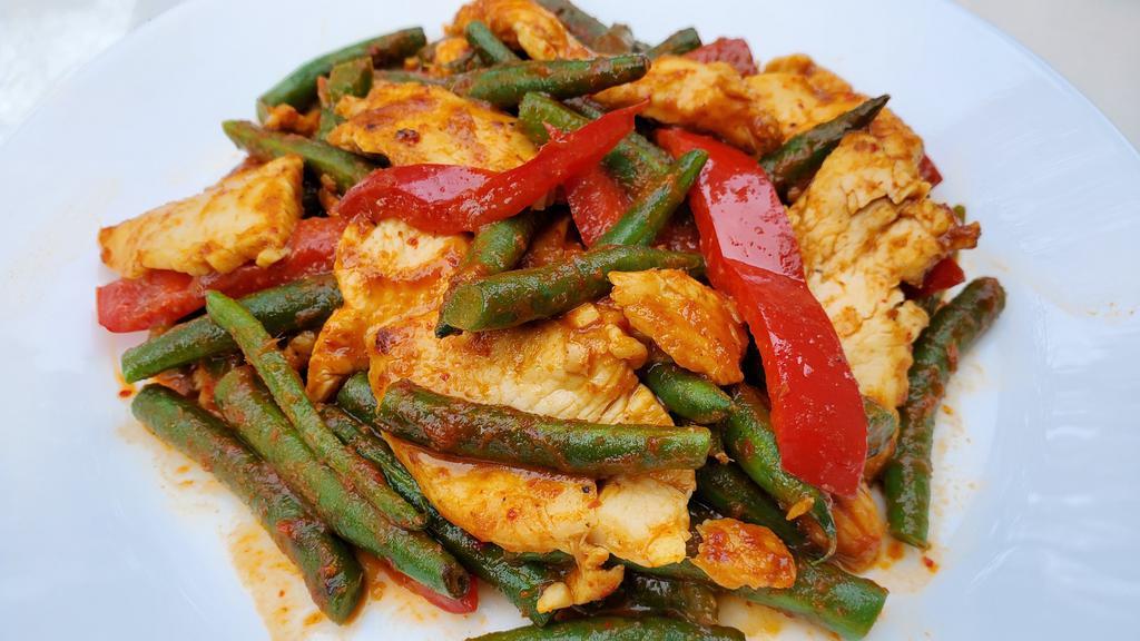 Pad Prik Khing · Stir-fried meat with string beans, bell peppers, and spicy red curry paste, Choice of meat, tofu, or just mixed vegetables. Comes with a side of Jasmine Rice. Spicy!