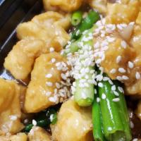 Crispy Tofu Special · Crispy tofu stir-fried with black sauce and sesame seeds, topped with peanuts and scallions....