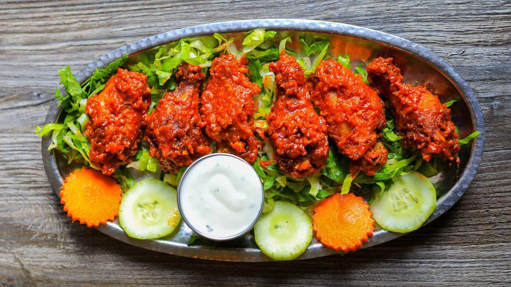 Chicken Masala Wings (5) · Gluten free. Chicken wings marinated in spices and fried. Served with ranch or blue cheese.