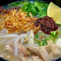 Khao Piak · Homemade Thick Rice Noodles, Chicken, Pork Blood, Fish Balls, Cilantro, Green Onions, Crispy...