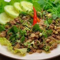 Larb Beef · Ground Beef, Herbs, Toasted Rice Powder, Cilantro, Green Onion, Mint, Lime, Served with Cucu...