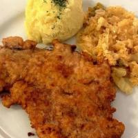 Wiened Schnitzel · Schabowy. Served with mashed potatoes, Fried Cabbage  or pickle salad