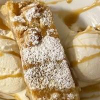 Apple Pie · Comes with a scoop of vanilla ice cream & caramel sauce.