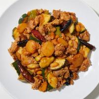 Kung Pao Chicken · Spicy stir-fried chicken with vegetables, peanuts, and chili peppers.