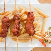 Chicken Skewers And Plantains Or Fries With Sauce · Three chicken skewers marinated in assorted herbs and spices and fried to perfection. Served...