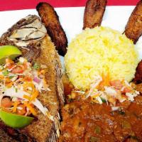 Lagos Delight · A platter of lamb stir fry and whole tilapia fish served with Pilau, jollof or Steamed rice,...