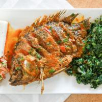 Fish In Sauce · Whole bone in tilapia fish marinated in assorted spices and deep fried to perfection then co...