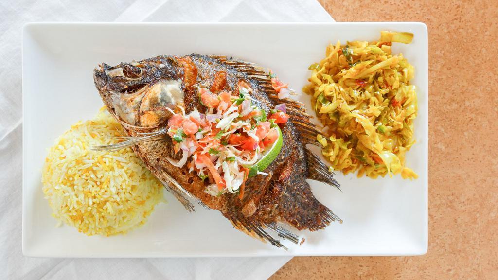 Whole Fried Tilpia Fish · Flavorful whole bone in tilapia fish marinated in assorted spices and deep fried to perfection. A house favorite. (Sauce on the side $ 1.00)
