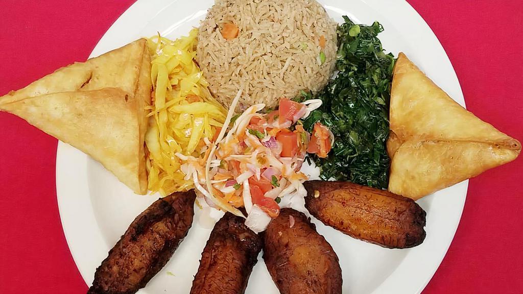 Vegetable Pilau Platter · Aged Basmati rice cooked with peas and carrots with fresh ginger, garlic and assorted spices and served with two vegetable samosas, sautéed cabbage, sautéed kale, kachumbari salad and fried plantains