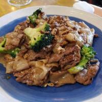 Pad See Ew · Pan-fried wide rice noodles, broccoli & egg with dark soy sauce.
