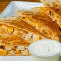 Chicken Quesadilla · Flour tortilla stuffed with meat and melted cheese and served with lettuce sour cream pico d...