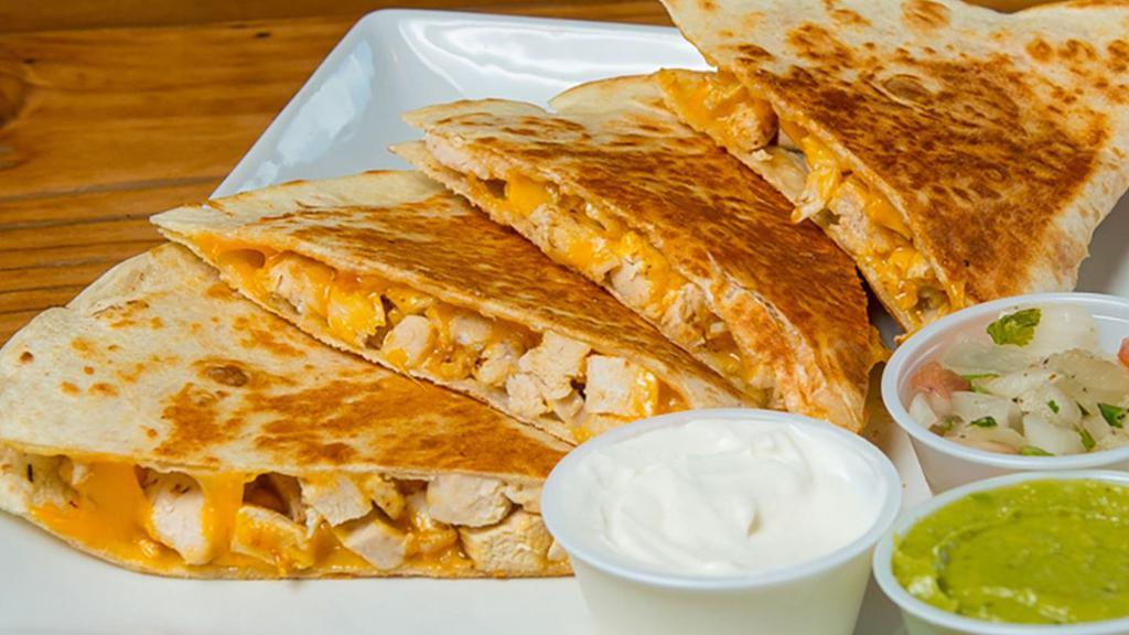 Chicken Quesadilla · Flour tortilla stuffed with meat and melted cheese and served with lettuce sour cream pico de gallo and guacamole.