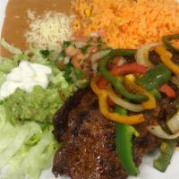 Steak (Platter) · Grilled Rib Eye 
Served with rice and fried beans and salad on the side