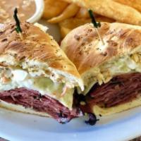911 Labels Sandwich · Grilled Pastrami Served on A Onion Rolls Smothered in Russian Dressing and topped with coles...