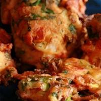 Tandoori Platter · 2 pieces each of Chicken tikka, bazari chicken, and lamb boti kebab grilled in clay oven.
