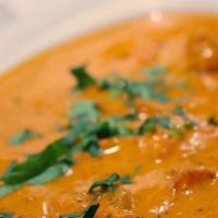 Butter Chicken · Boneless thigh meat slow fire cooked in butter tomato sauce with special fenugreek herbs.