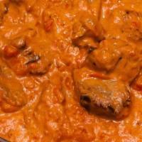 Lamb Tikka Masala · Boneless lamb simmered in our signature butter cream and tomato sauce. Served with rice.