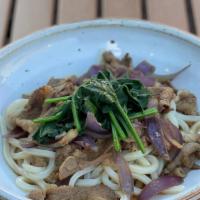 Sukiyaki Beef Udon · Udon topped with spinach, slow cooked beef and onion in homemade sukiyaki sauce.