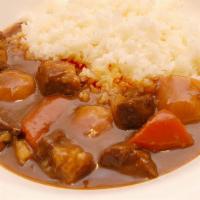 Curry & Rice · Homemade beef curry (beef, carrots, potato and onion) served with a bed of premium white rice.