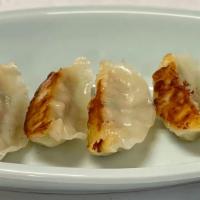 Gyoza · Vegetarian. Six pieces of pan-seared crispy bottom pork chicken dumplings / veggie. Served w...