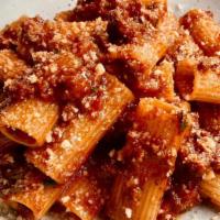 Tagliatelle Bolognese · Traditional Bolognese Sauce, Rosemary, Parmigiano (contains pork)