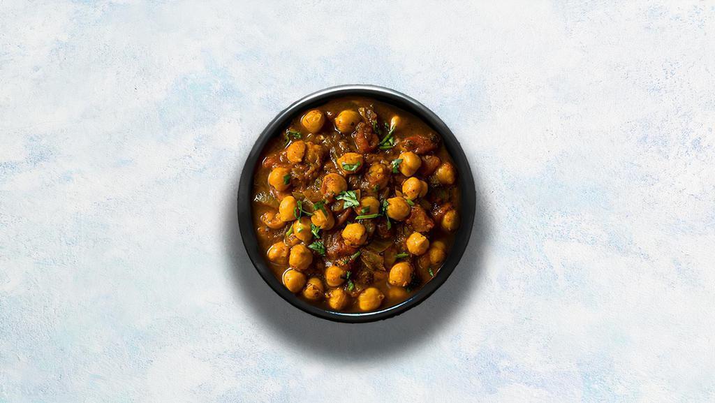Channa Masala · Chickpeas cooked with farm-fresh vegetables and special herbs. Served with a portion of aromatic basmati rice.