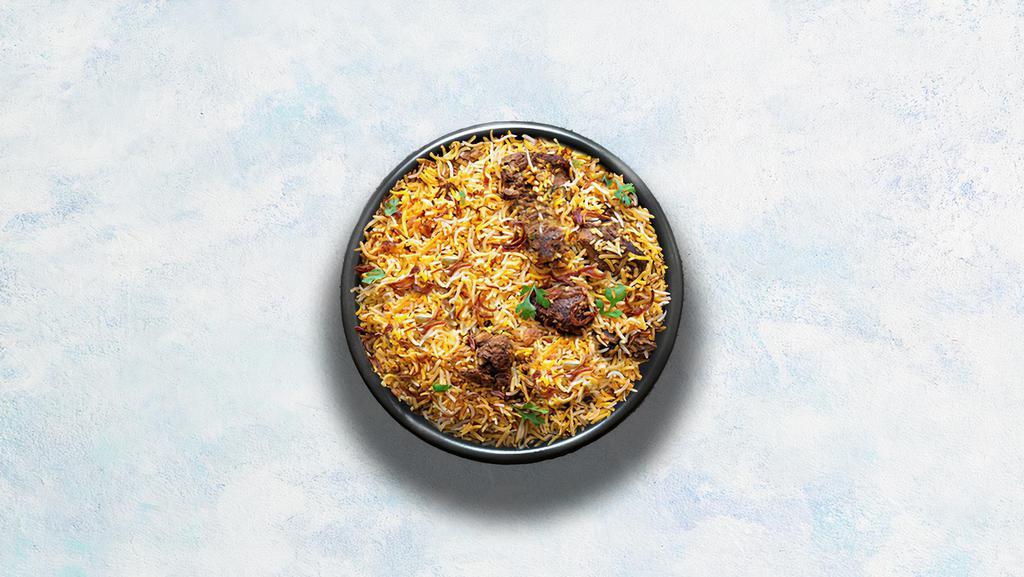 Goat Biryani · Long grain basmati rice cooked with tender goat and aromatic Indian herbs. Served with raita.