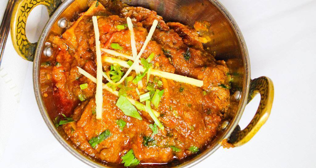 Lamb Curry · Fresh chunks of lamb cooked with ginger and garlic in our chef's secret sauce.