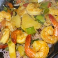 Coconut Curry Shrimp · Served with rice and peas or white rice. Your choice of fried plantains and steam veggie.