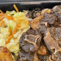 Oxtail Stew · Served with rice and peas or white rice. your choice of fried plantains and steam veggies.