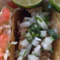 Tacos · Cilantro, onion, limes, and salsa on the side.