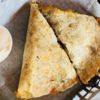 Cheese Quesadilla - Half · Served with guacamole and sour cream.