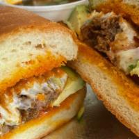 Pastor Torta · Our marinted pork in our daily fresh telera bun, a layer of refried beans some shredded lett...