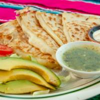 Asada Quesadilla · Loaded steak and and cheese quesadilla served w a side of sour cream