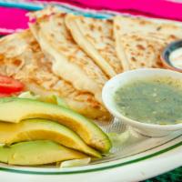 Chicken Quesadilla · Loaded shredded chicken and and cheese quesadilla served w a side of sour cream