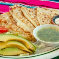 Pastor Quesadilla · Loaded pastor and and cheese quesadilla served w a side of sour cream