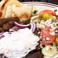 Gyro Plate · Gyro meat, Greek salad and sliced pita bread.