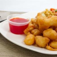 Sweet & Sour Chicken · Served with pork fried rice or white rice and egg roll.