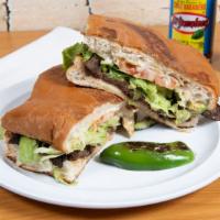 Tortas Mexicanas · Served On Special Mexican Bread with Re fried Beans along your choice of meet- CHICKEN or BE...