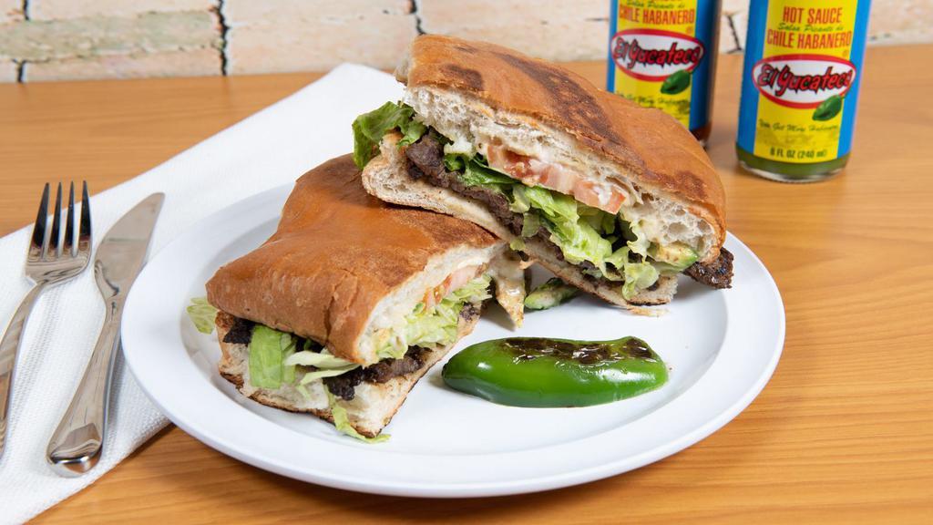 Tortas Mexicanas · Served On Special Mexican Bread with Re fried Beans along your choice of meet- CHICKEN or BEEF -Come with lettuce, tomato, mayonnaise, jalapeno, and guacamole.