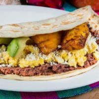 Baleadas De Huevo · A Traditional Honduran dish composed of a flour thick tortilla,folded in half and filled wit...