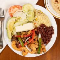 Fajita Mixta · Mixed chicken, beef, and shrimp served with salad, avocado, cheese, lemon rice, beans, and t...