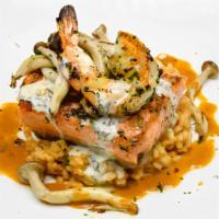 Grilled Atlantic Salmon · Wild Mushrooms, Shrimp, Lobster Risotto, & Lemon-Tarragon Essence. Gluten-Sensitive.