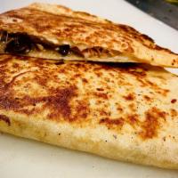 Cheese Quesadilla · Flour tortilla folded in half and stuffed with cheese.  Served with a side of your choice of...