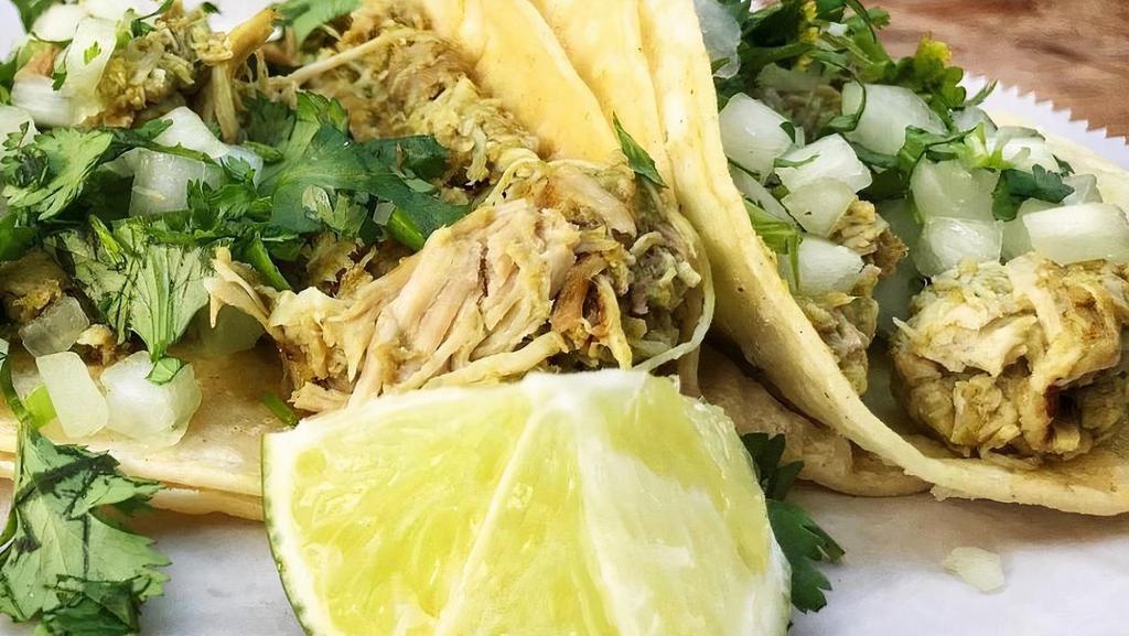 Pollo Verde (After 11Am) · Served street style on a corn tortilla (flour available by request) with shredded chicken in a salsa verde and topped with onion and cilantro